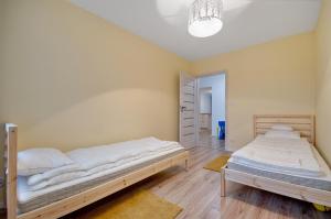 מיטה או מיטות בחדר ב-Apartment Kordiana