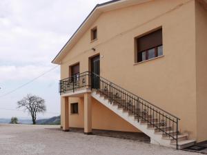 a building with a staircase on the side of it at B&B da Eli in San Pietro