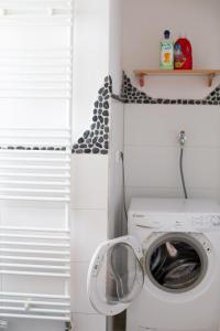 a laundry room with a washer and a washing machine at Pia Fewo Günzburg in Günzburg