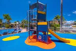 a playground at a park with a slide at Mountain View Resort in Shoalhaven Heads