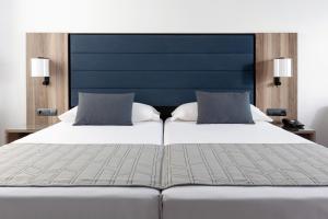 Hotel Riu Palace Oasis客房内的一张或多张床位