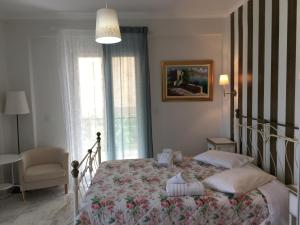 Postel nebo postele na pokoji v ubytování Hotel Avra