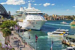 a cruise ship docked in a harbor with boats at STUNNING SYDNEY HOME 7 in Sydney