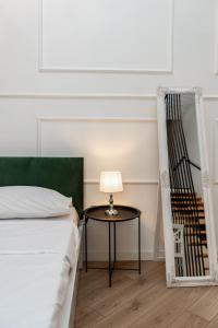 Кровать или кровати в номере Shota Rustaveli Aparthotel
