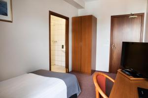 TV a/nebo společenská místnost v ubytování Fosshotel Baron