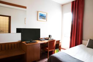 TV a/nebo společenská místnost v ubytování Fosshotel Baron