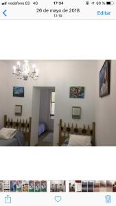 two pictures of a bedroom with two beds in a room at Hotel Comodoro in Portbou