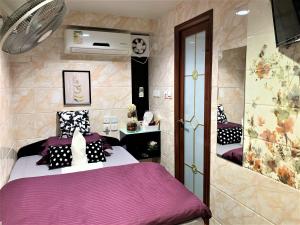 Ένα ή περισσότερα κρεβάτια σε δωμάτιο στο Super Guest House