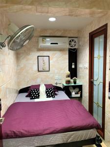 Ένα ή περισσότερα κρεβάτια σε δωμάτιο στο Super Guest House
