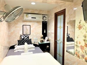 Ένα ή περισσότερα κρεβάτια σε δωμάτιο στο Super Guest House