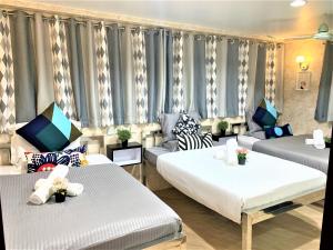 Ένα ή περισσότερα κρεβάτια σε δωμάτιο στο Super Guest House