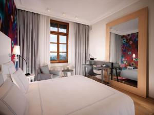 Ein Bett oder Betten in einem Zimmer der Unterkunft Hôtel Métropole Genève