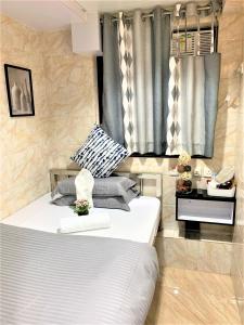 Ένα ή περισσότερα κρεβάτια σε δωμάτιο στο Super Guest House