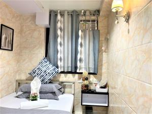 Ένα ή περισσότερα κρεβάτια σε δωμάτιο στο Super Guest House