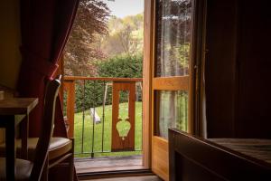 a window with a view of a yard at Hotel Beau Sejour Pré-Saint-Didier in Pré-Saint-Didier