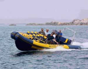 a group of people on a raft in the water at Apartamentos El Castañeu in Corao