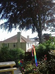 a colorful kite in a garden in front of a house at Ellerton B&B in Bideford