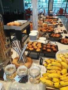 a buffet with bananas and pastries on a table at Best Western Hotel Rome Airport in Fiumicino