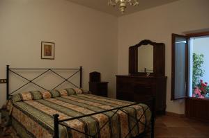 Postel nebo postele na pokoji v ubytování Agriturismo Le Rose + 90 fotografií