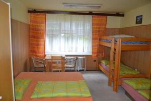 Posteľ alebo postele v izbe v ubytovaní Hostel Fortuna