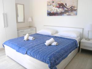 Säng eller sängar i ett rum på Apartments Sokolović