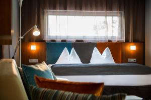 Postel nebo postele na pokoji v ubytování ALIA appartements & wellness