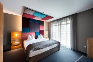Postel nebo postele na pokoji v ubytování ALIA appartements & wellness