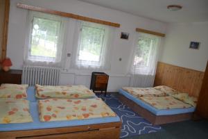 Posteľ alebo postele v izbe v ubytovaní Hostel Fortuna