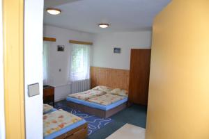 Posteľ alebo postele v izbe v ubytovaní Hostel Fortuna