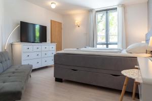 TV a/nebo společenská místnost v ubytování Hotel Am Dom