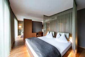 Postel nebo postele na pokoji v ubytování ALIA appartements & wellness