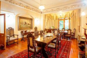 a dining room with a table and chairs at Birdwood Boutique Estate in Pretoria