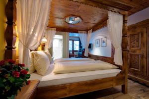 Postel nebo postele na pokoji v ubytování Hotel Astoria