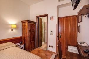 Postel nebo postele na pokoji v ubytování Hotel Gea Di Vulcano
