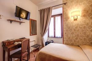 Postel nebo postele na pokoji v ubytování Hotel Gea Di Vulcano