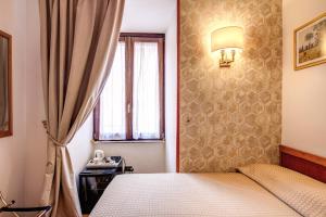 Postel nebo postele na pokoji v ubytování Hotel Gea Di Vulcano
