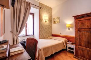 Postel nebo postele na pokoji v ubytování Hotel Gea Di Vulcano