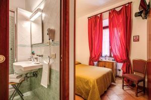 Postel nebo postele na pokoji v ubytování Hotel Gea Di Vulcano