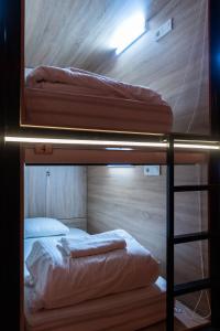 Łóżko lub łóżka w pokoju w obiekcie Hostel Inbox