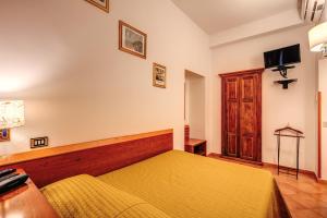 Postel nebo postele na pokoji v ubytování Hotel Gea Di Vulcano
