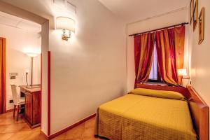 Postel nebo postele na pokoji v ubytování Hotel Gea Di Vulcano