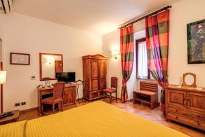 Postel nebo postele na pokoji v ubytování Hotel Gea Di Vulcano