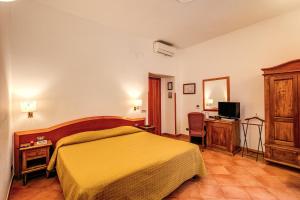 Postel nebo postele na pokoji v ubytování Hotel Gea Di Vulcano