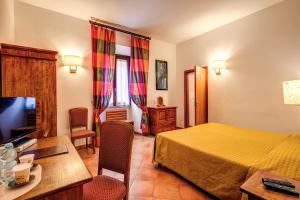Postel nebo postele na pokoji v ubytování Hotel Gea Di Vulcano