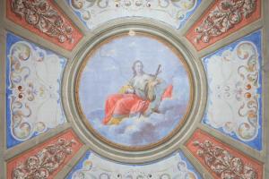 a painting of a woman on the ceiling of a building at B&B I Quattro Poeti in Florence