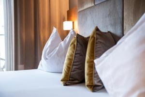 Postel nebo postele na pokoji v ubytování ALIA appartements & wellness