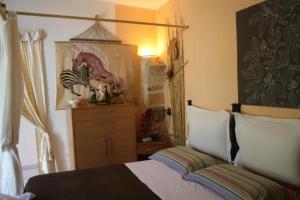 Postel nebo postele na pokoji v ubytování Mini suite alla Cascata