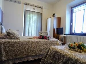 Postel nebo postele na pokoji v ubytování Le Mimose B&B
