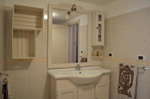 a bathroom with a white sink and a mirror at Eden De Martino in Monopoli +26 photos