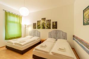 Letto o letti in una camera di Hotel Markgraf Leipzig
